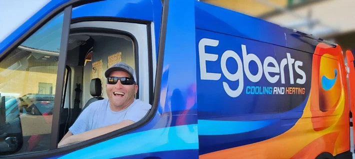 plumber in branded truck